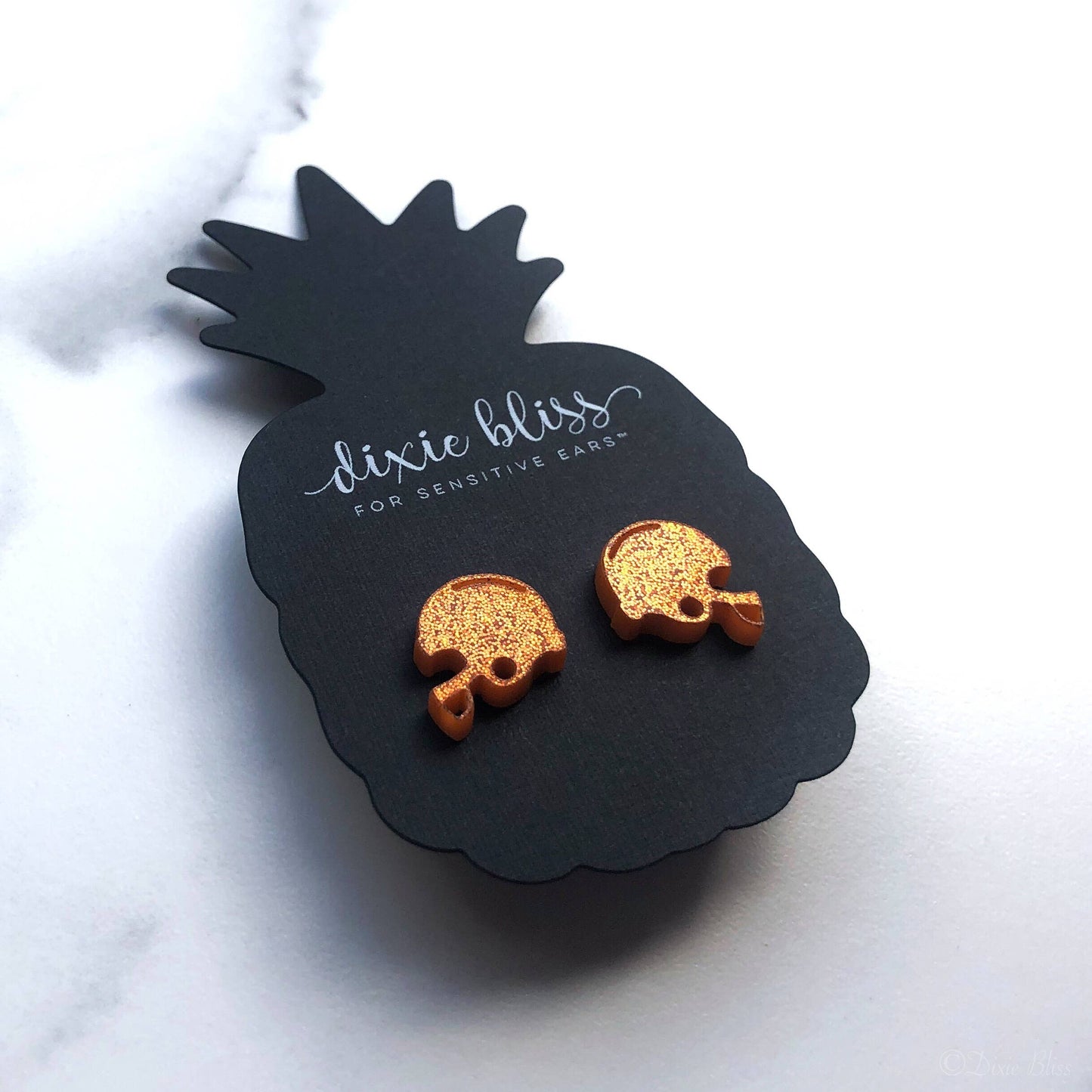 Football helmet earrings – orange glitter acrylic studs with hypoallergenic posts