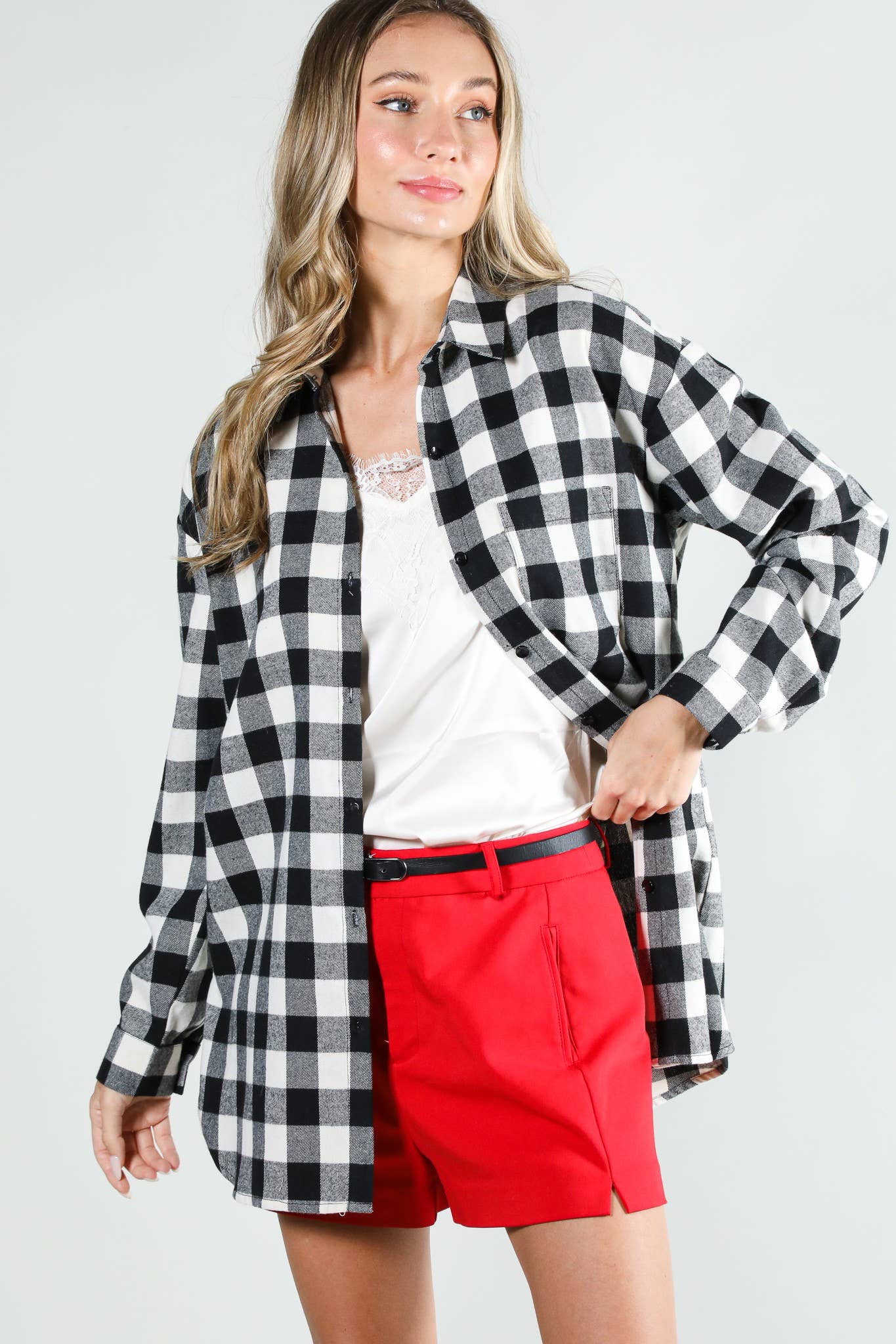 Long sleeve plaid button-up shirt in black and white — Front View